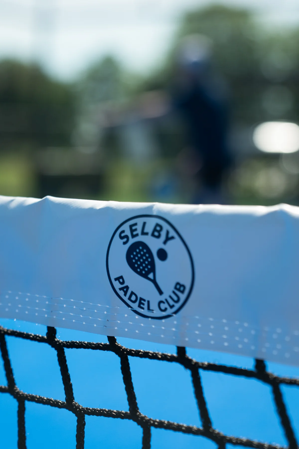 Selby Padel Club logo printed on the white net tape